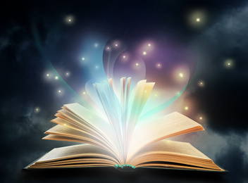 Image of Open book with fairytales and magic lights. Creative design