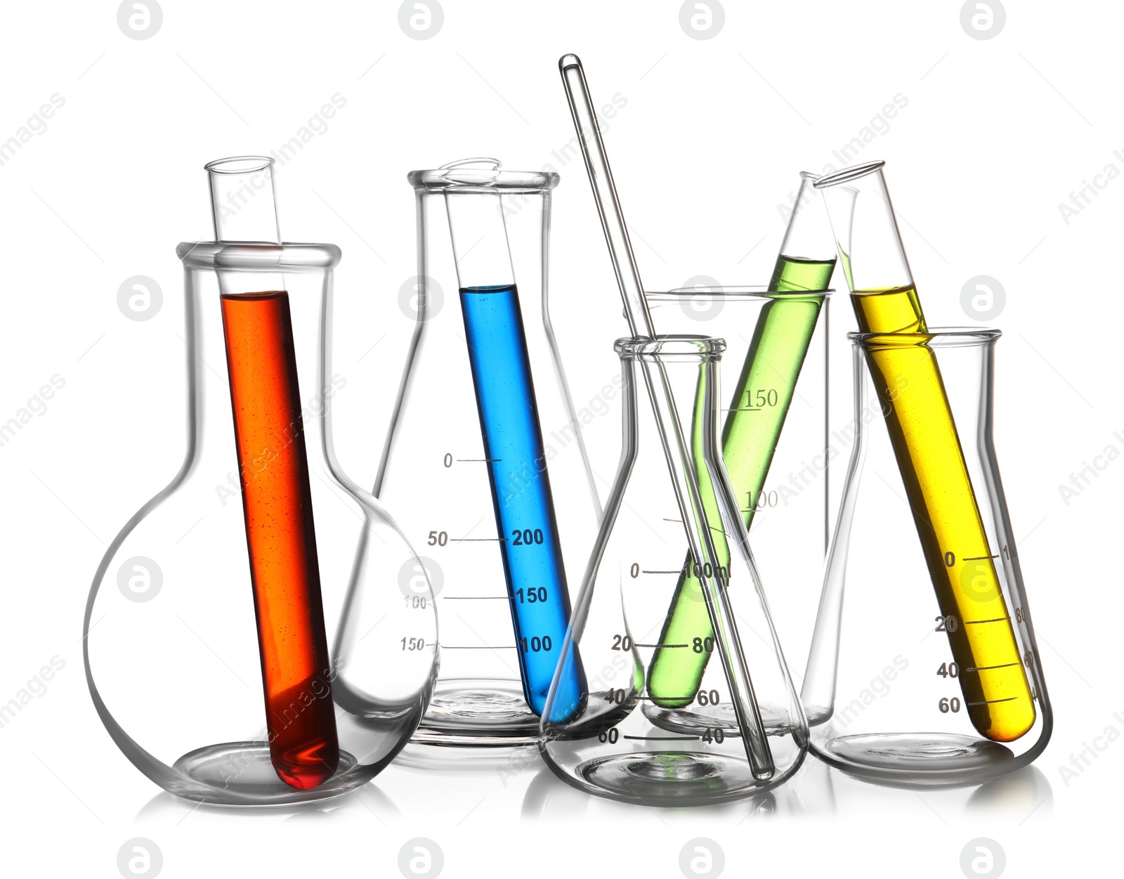 Photo of Glass flasks, beaker and test tubes with colorful liquids isolated on white