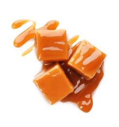 Sweet caramel candies with topping isolated on white, top view