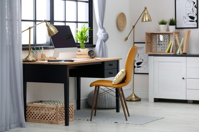 Photo of Modern home workplace with wooden crates. Eco style interior