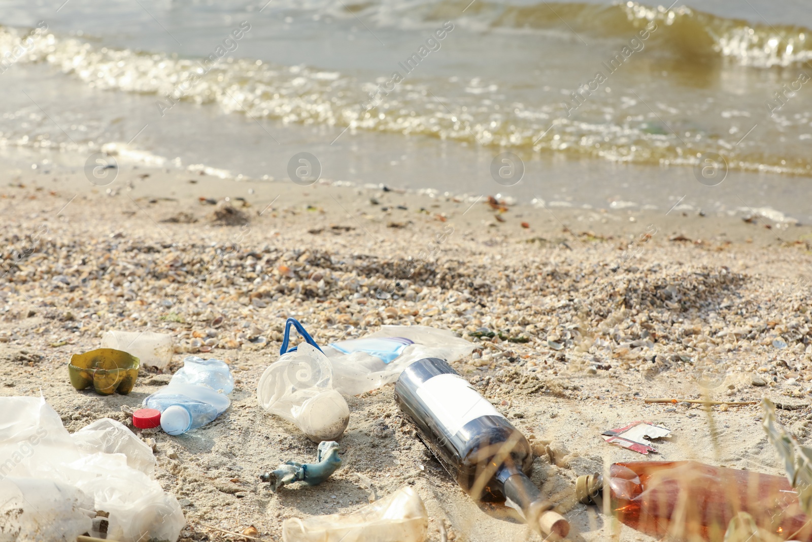 Photo of Garbage scattered on beach. Environment pollution problem