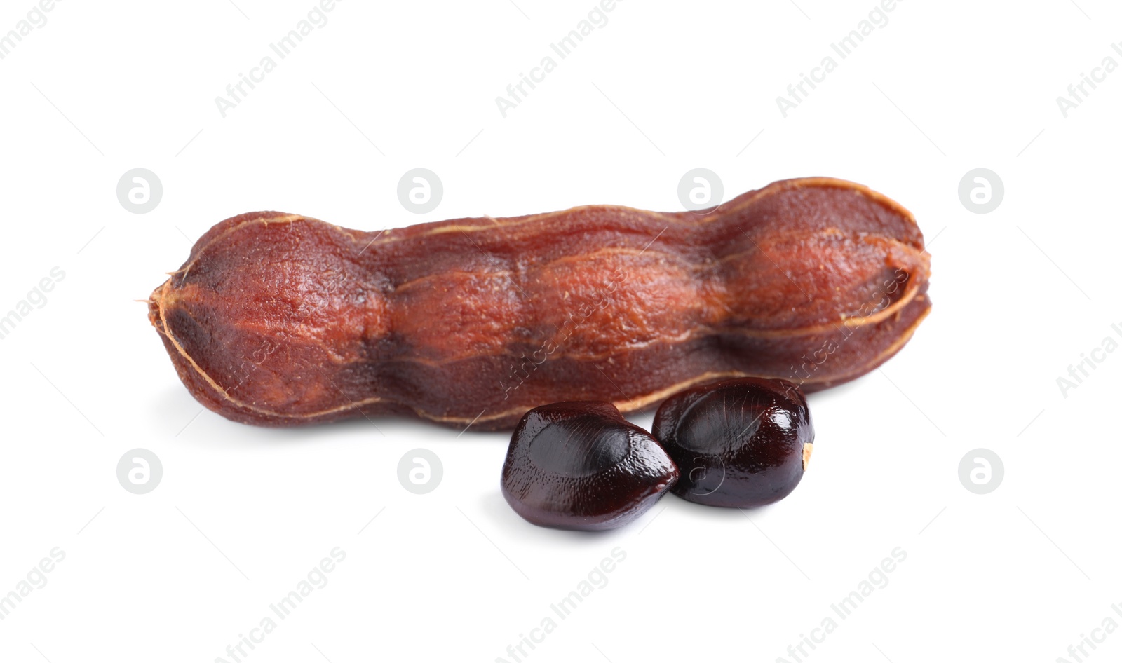 Photo of Ripe peeled tamarind and seeds on white background. Exotic fruit