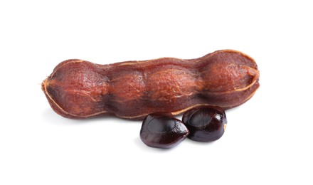 Ripe peeled tamarind and seeds on white background. Exotic fruit