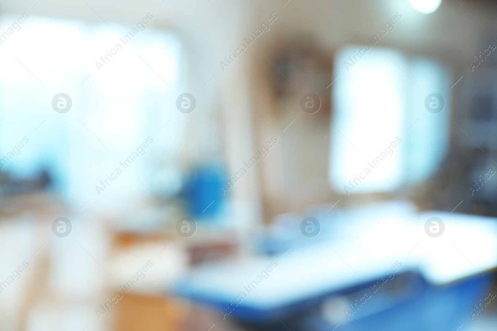 Photo of Blurred view of carpentry shop interior. Working space