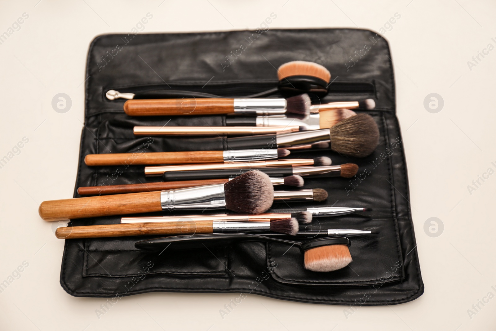 Photo of Organizer full of professional tools on makeup artists workplace
