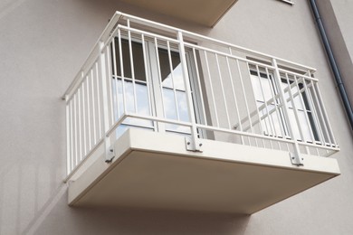 Exterior of beautiful building with empty balcony