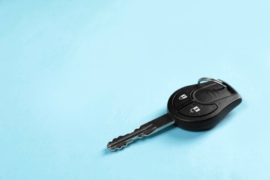 Car key on color background. Space for text