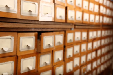 Photo of Blurred view of library card catalog drawers