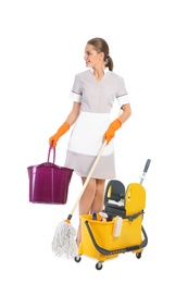 Photo of Young chambermaid with cleaning supplies on white background