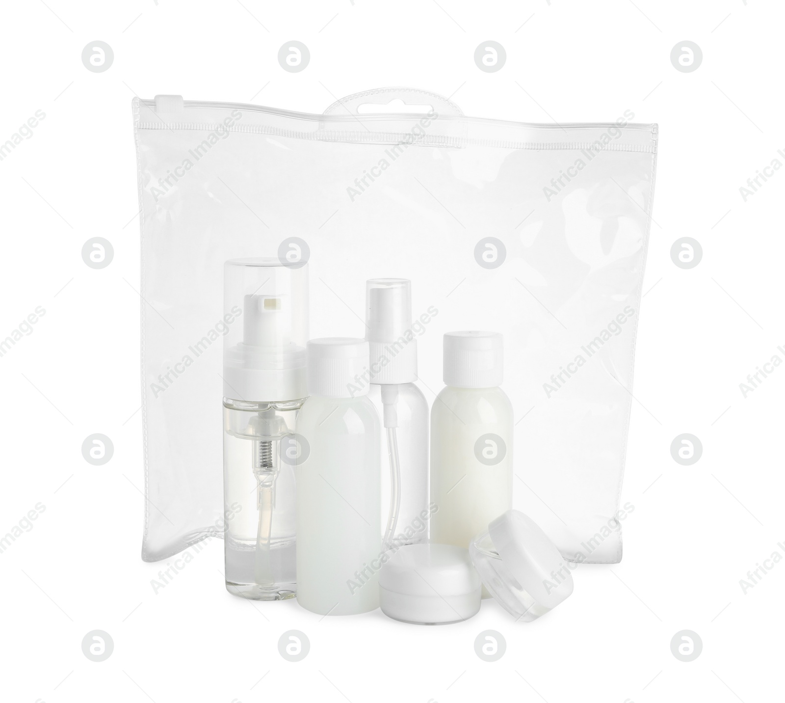 Photo of Cosmetic travel kit in plastic bag isolated on white. Bath accessories