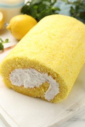 Delicious cake roll on table, closeup view