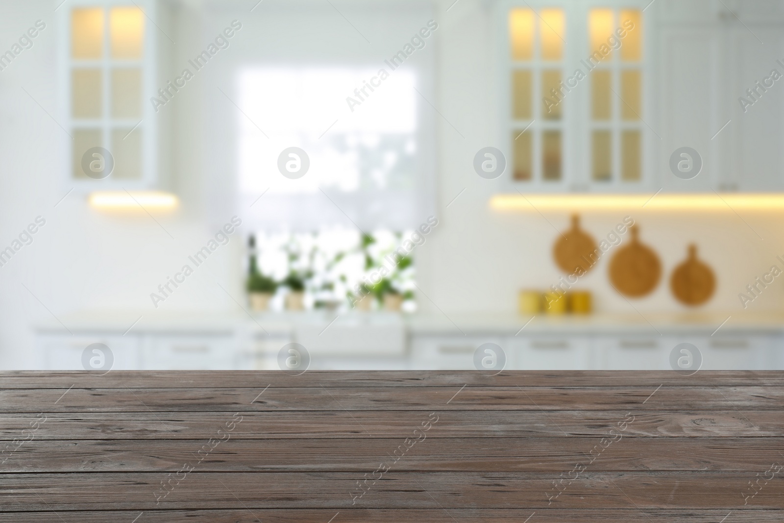 Image of Empty wooden table and blurred view of stylish kitchen interior. Mockup for design