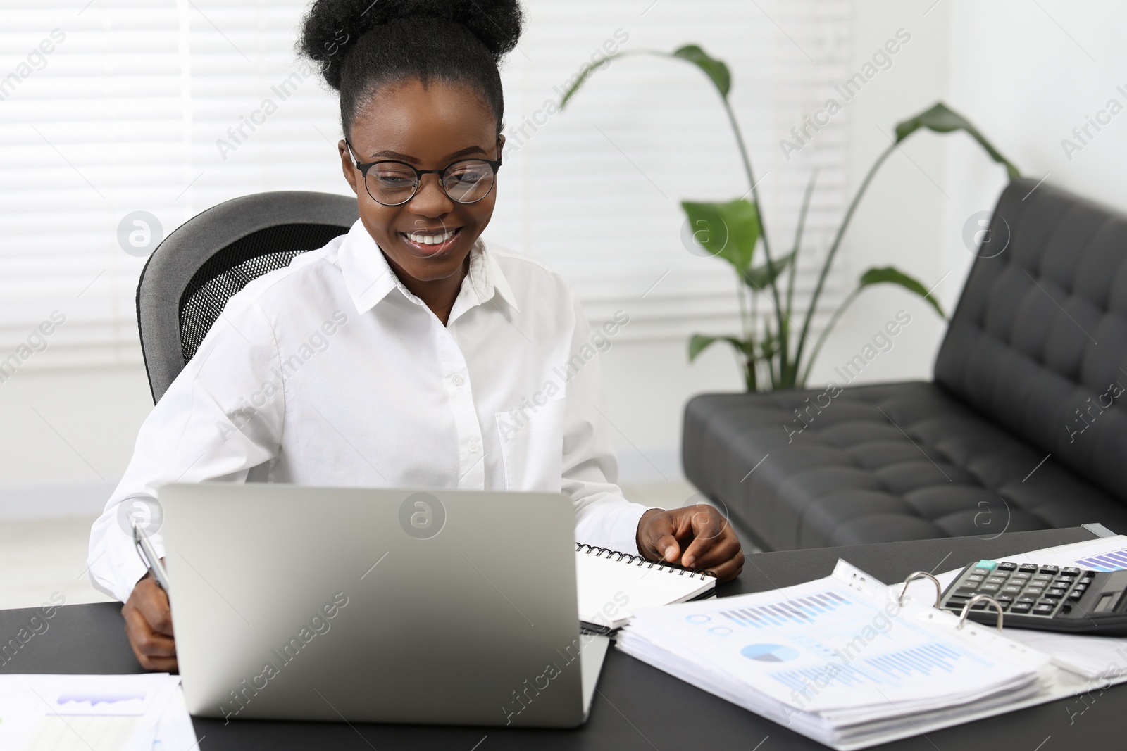 Photo of Professional accountant working on computer at desk in office