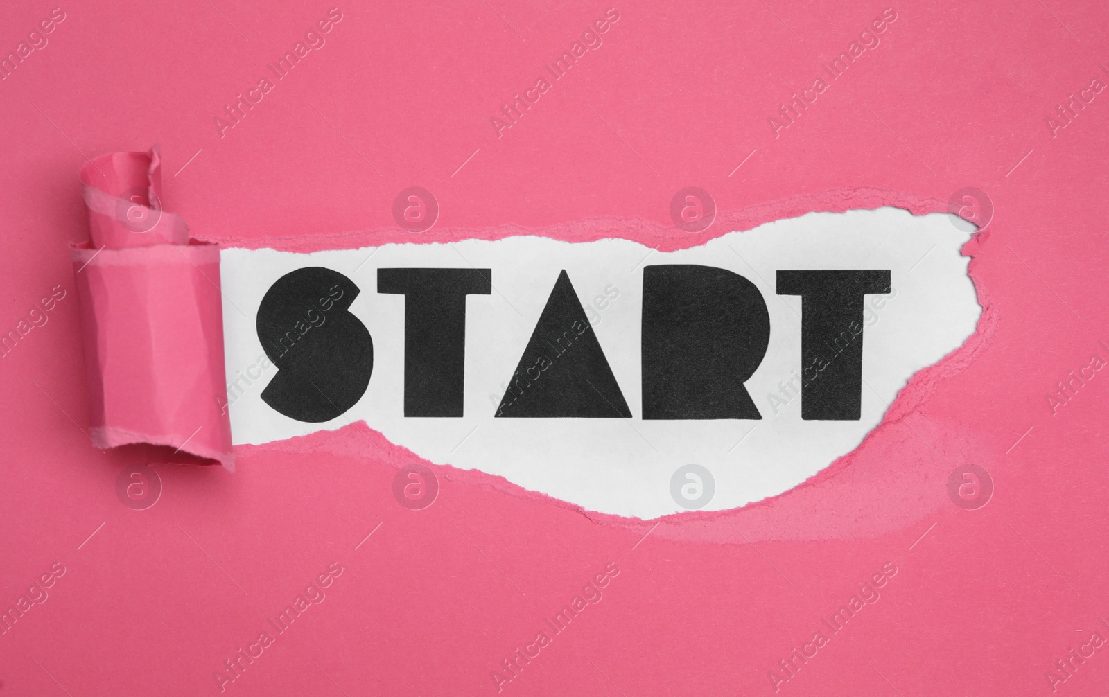 Photo of Word Start on white background, view through torn pink paper