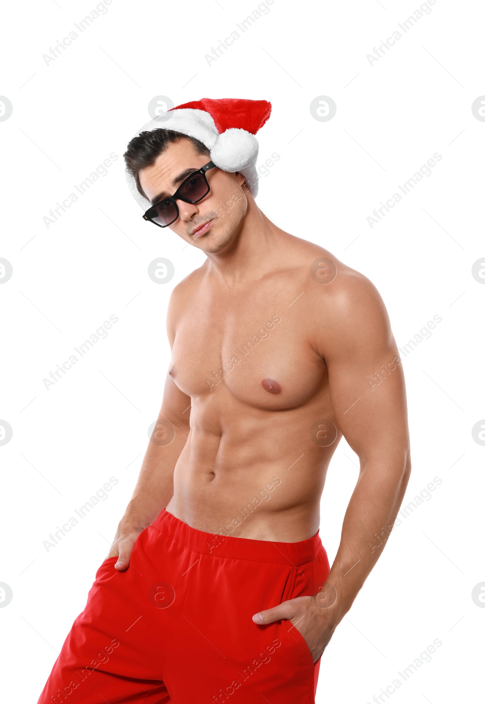 Photo of Sexy shirtless Santa Claus on white background