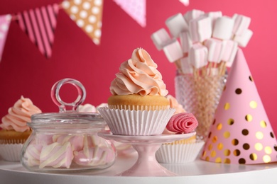 Tasty cupcake and other sweets on table. Candy bar, closeup view