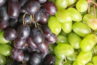 Photo of Fresh ripe juicy grapes as background, closeup