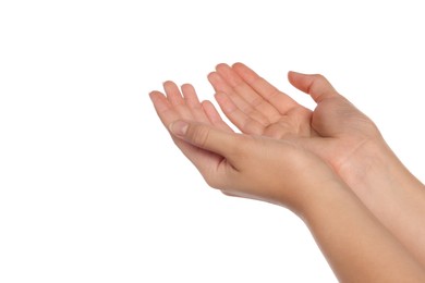 Woman holding her hands against white background, closeup