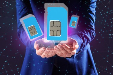 Image of Man demonstrating SIM cards of different sizes on color background, closeup 