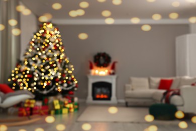 Blurred view of beautiful Christmas tree in stylish living room interior. Bokeh effect