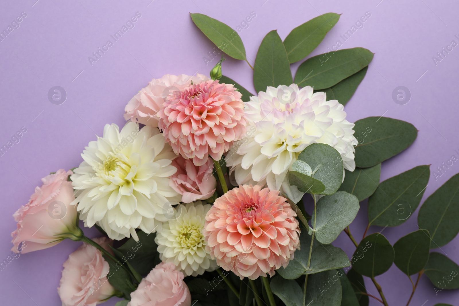 Photo of Bouquet of beautiful fresh flowers on violet background, top view