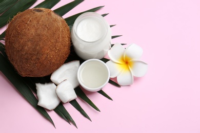 Photo of Beautiful composition with coconut oil and nuts on color background