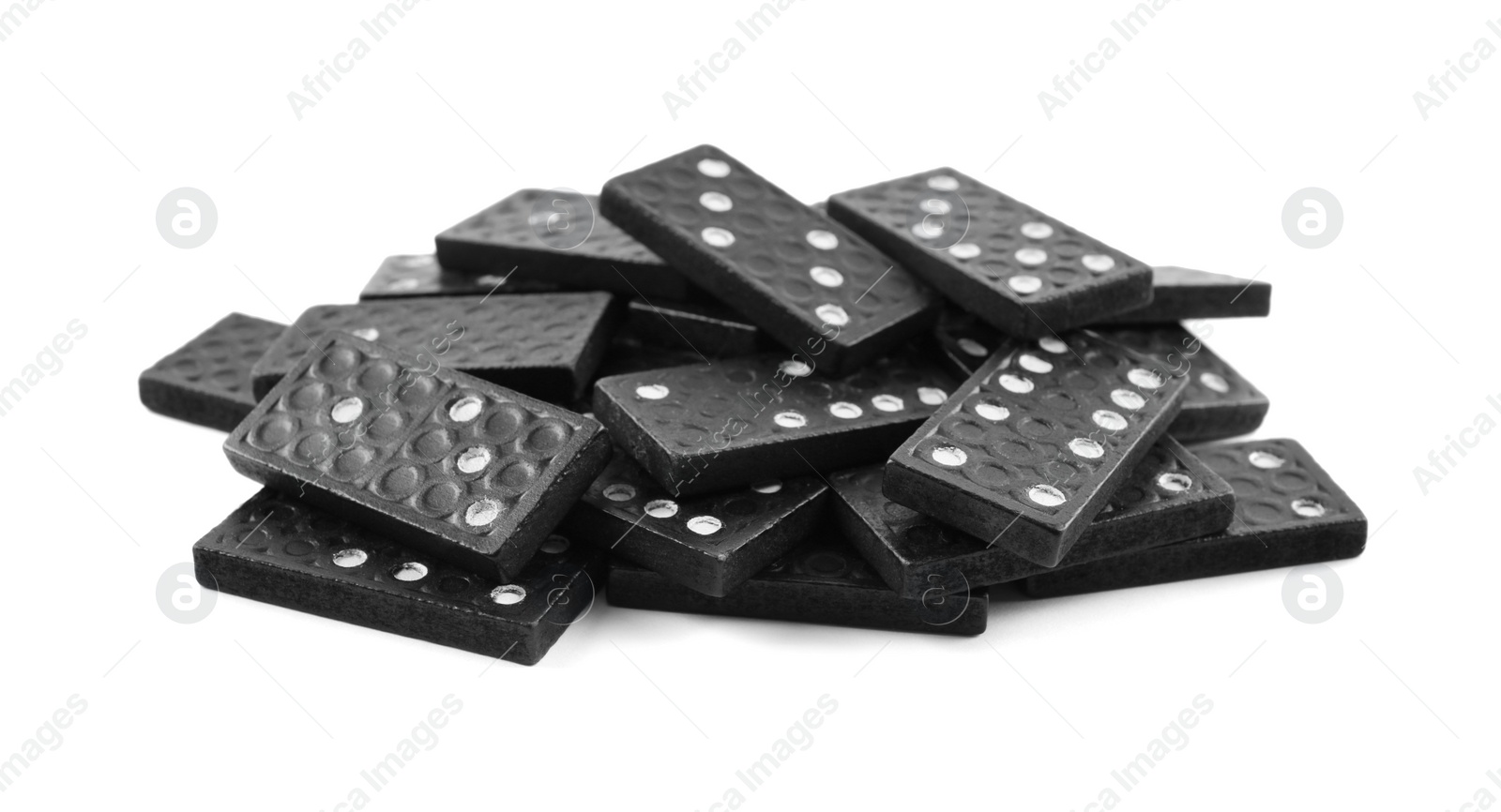 Photo of Pile of black domino tiles on white background