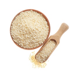 Bowl and scoop with sesame seeds on white background, top view