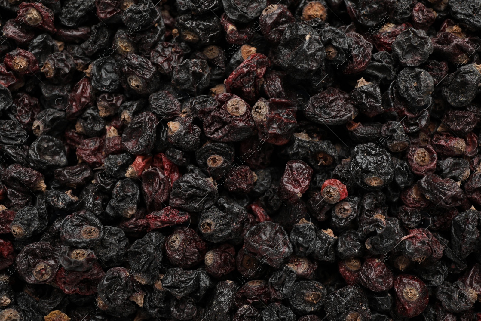 Photo of Heap of tasty dried currants as background, top view