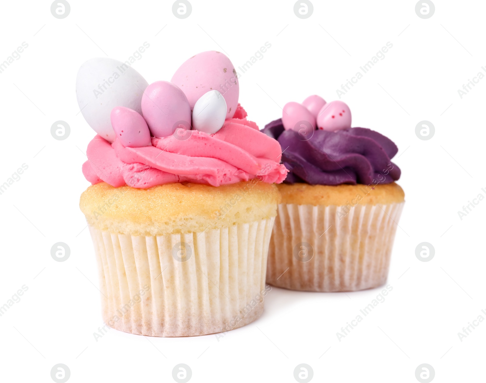 Photo of Tasty decorated Easter cupcakes isolated on white