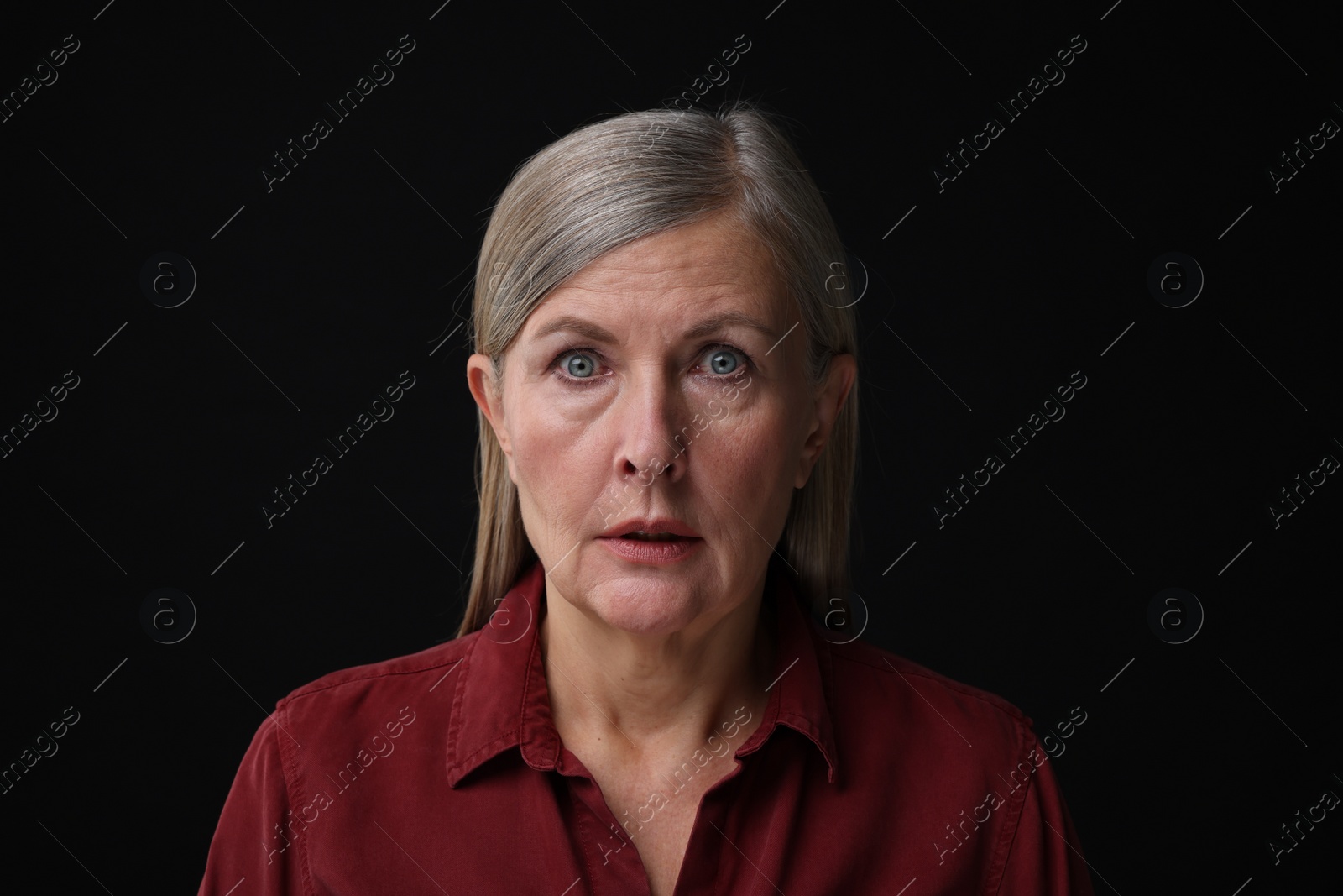 Photo of Personality concept. Portrait of emotional woman on black background