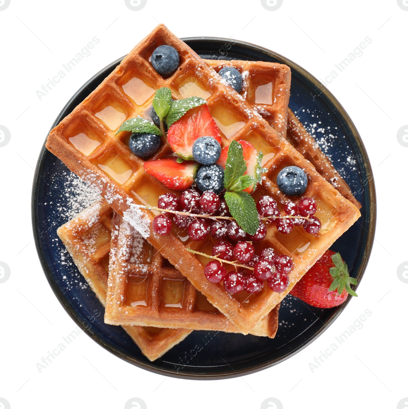 Photo of Delicious Belgian waffles with berries on white background, top view