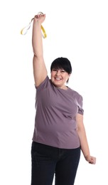 Happy overweight mature woman with measuring tape on white background