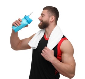 Photo of Young man with muscular body holding shaker of protein and towel on white background