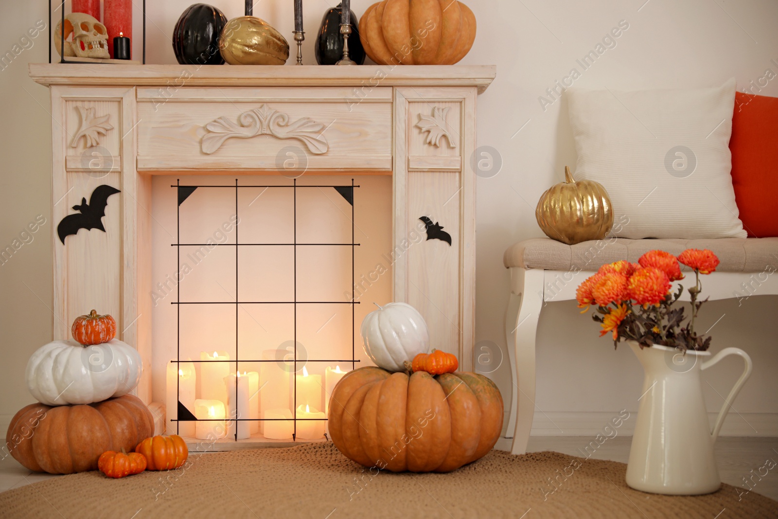 Photo of Fireplace and Halloween decor in room. Idea for festive interior