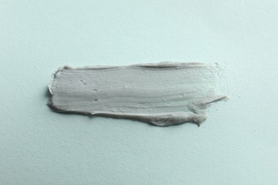 Photo of Sample of face mask on light background, top view