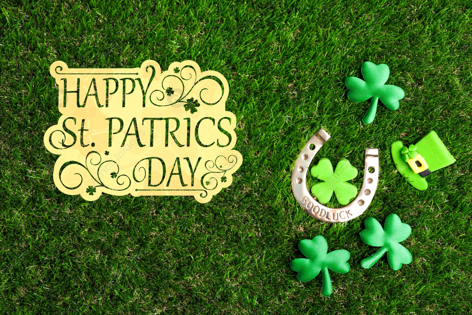 Image of Flat lay composition with horseshoe on green grass. St. Patrick's Day celebration