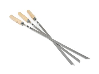 Photo of Metal skewers with wooden handle on white background