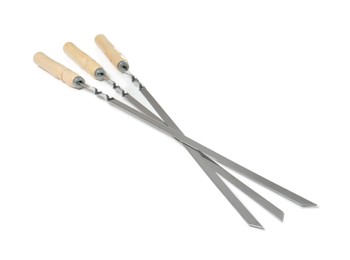 Metal skewers with wooden handle on white background