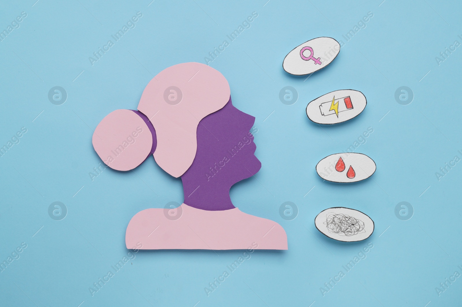 Photo of Woman's health. Female paper figure and different stickers on light blue background, flat lay