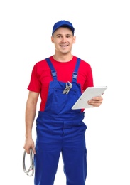 Young plumber with tablet computer on white background