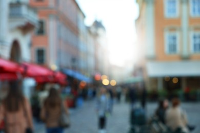 Blurred view of people walking on city street