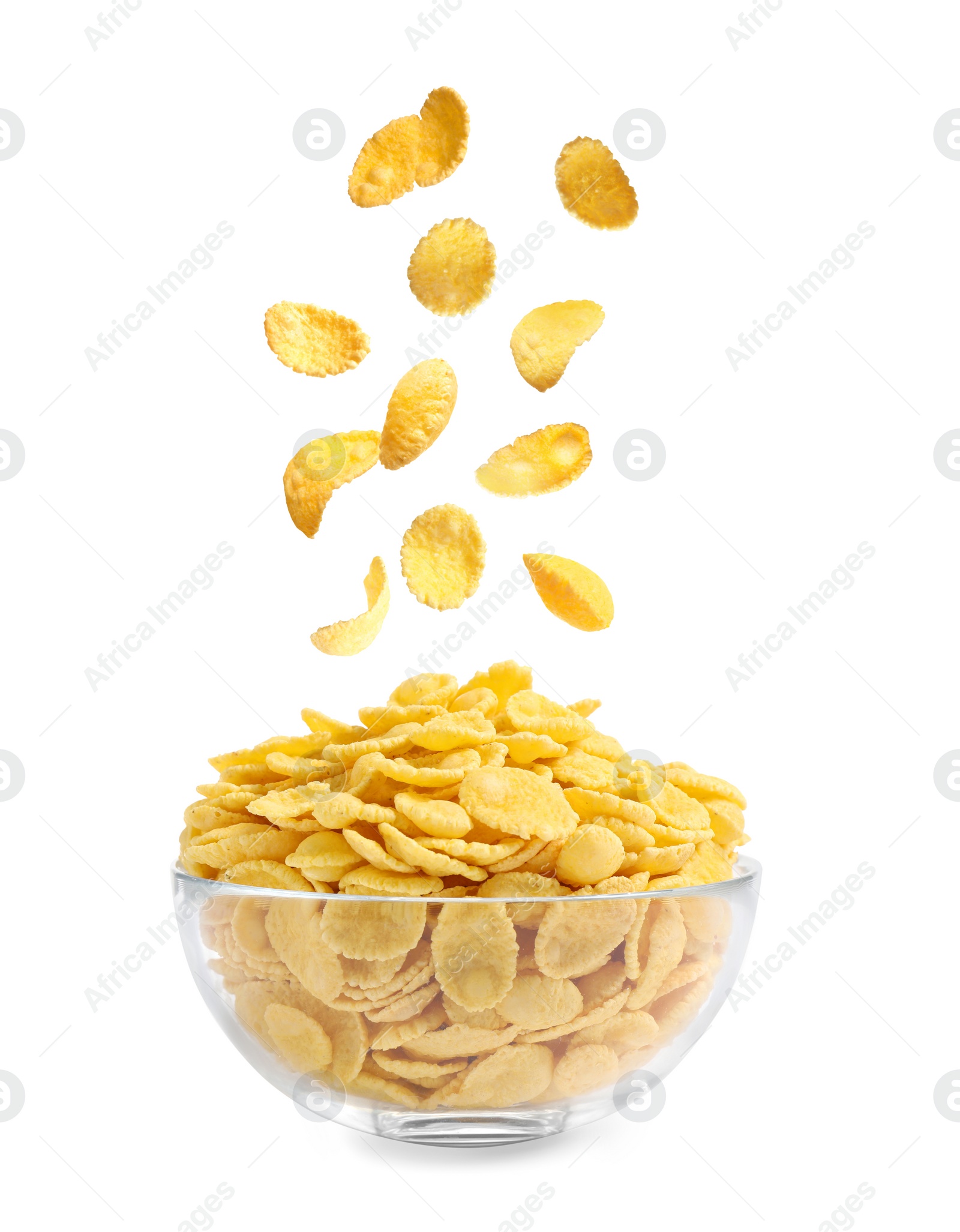 Image of Tasty crispy corn flakes falling into bowl on white background