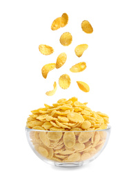 Image of Tasty crispy corn flakes falling into bowl on white background