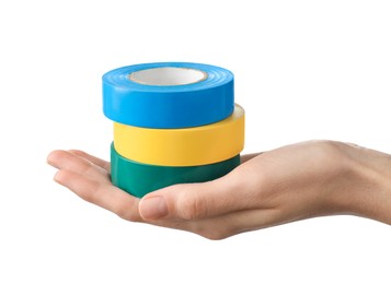 Photo of Woman holding colorful insulating tapes on white background, closeup