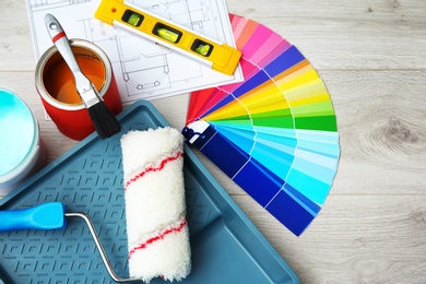 Set of decorator's tools on wooden floor