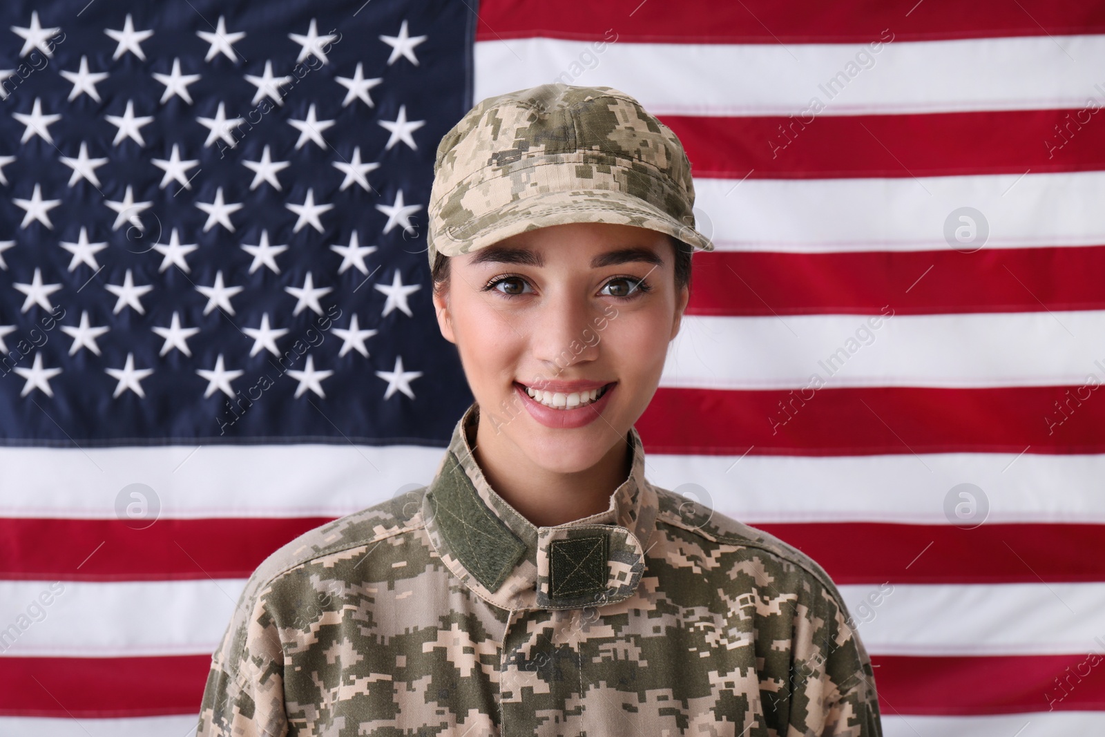 Photo of Female soldier in uniform against United states of America flag