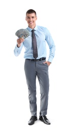 Handsome businessman with dollars on white background