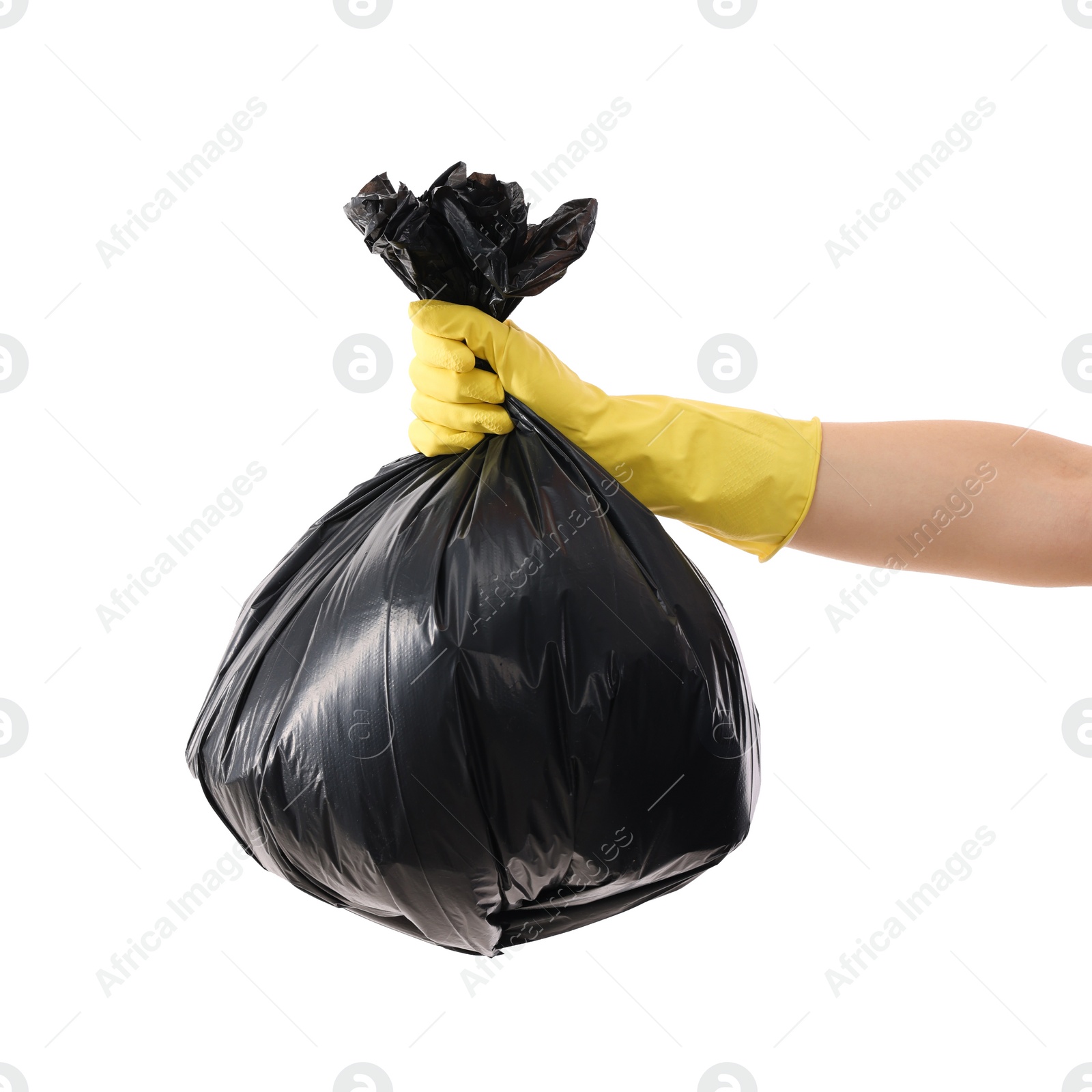 Photo of Woman holding plastic bag full of garbage on white background, closeup