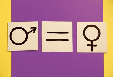 Photo of Gender equality. Cards with equal sign, male and female symbols on color background, flat lay